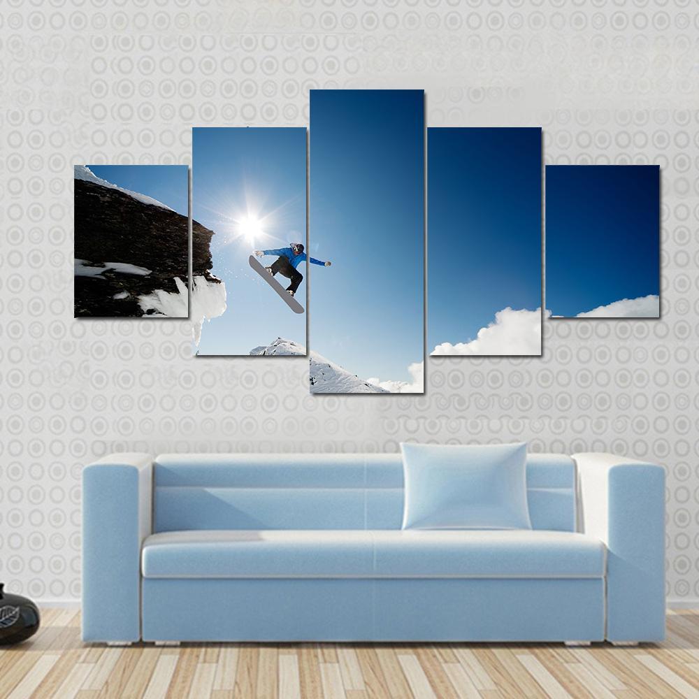 Snowboarder Jumping Through Air After Rock Drop Canvas Wall Art-4 Pop-Gallery Wrap-50" x 32"-Tiaracle