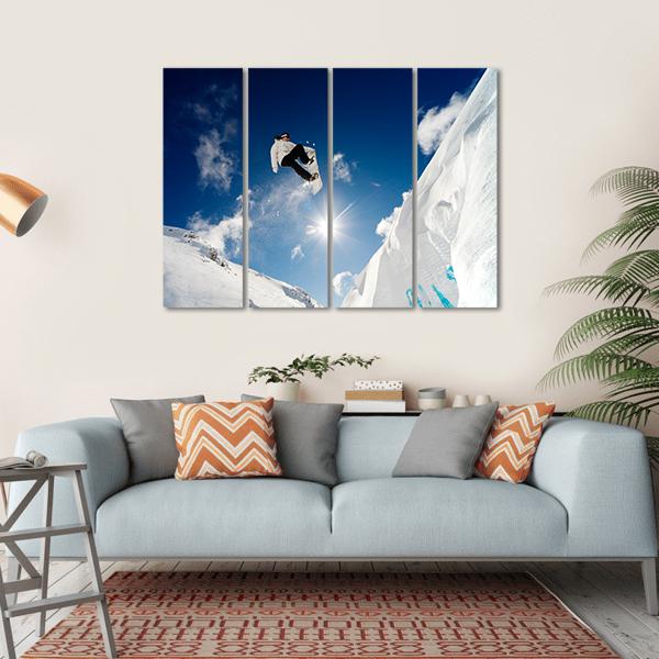 Snowboarder Jumping Through The Air With Blue Sky Canvas Wall Art-4 Horizontal-Gallery Wrap-34" x 24"-Tiaracle