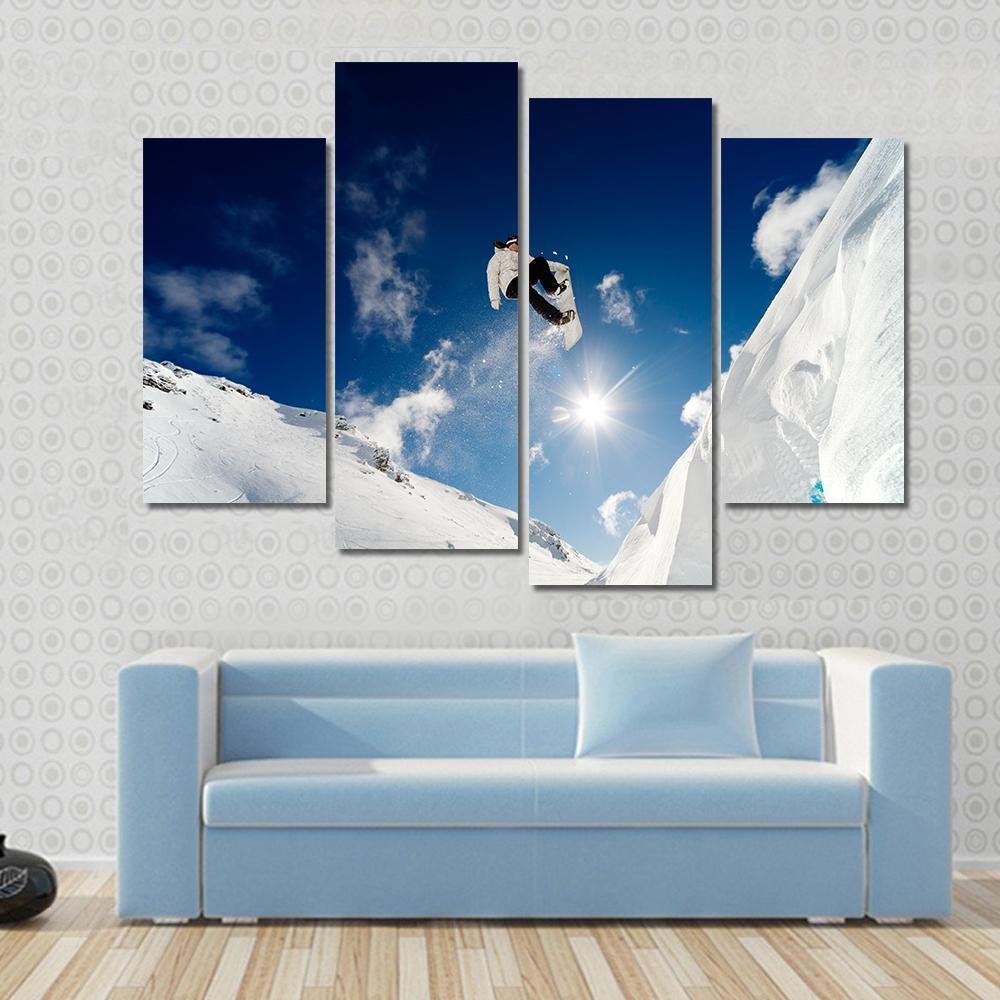 Snowboarder Jumping Through The Air With Blue Sky Canvas Wall Art-4 Pop-Gallery Wrap-50&quot; x 32&quot;-Tiaracle