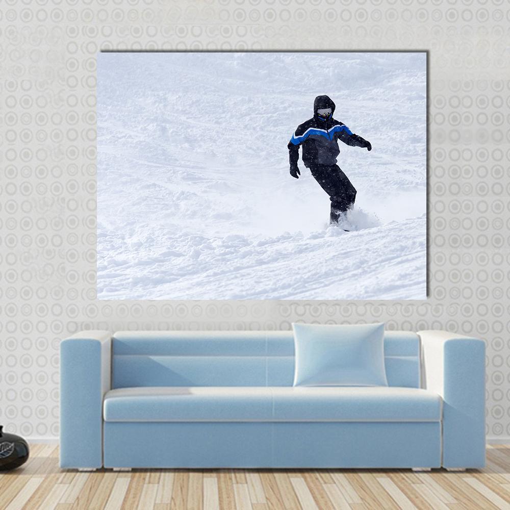 Snowboarder in Motion Canvas Wall Art in black, white and blue, single panel hung on a wall