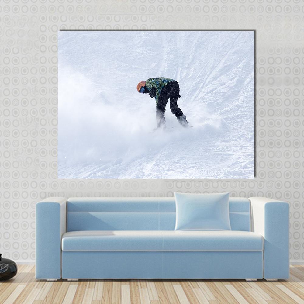 Snowboarder on Snow Canvas Wall Art in black, white and blue, single panel hung on a wall