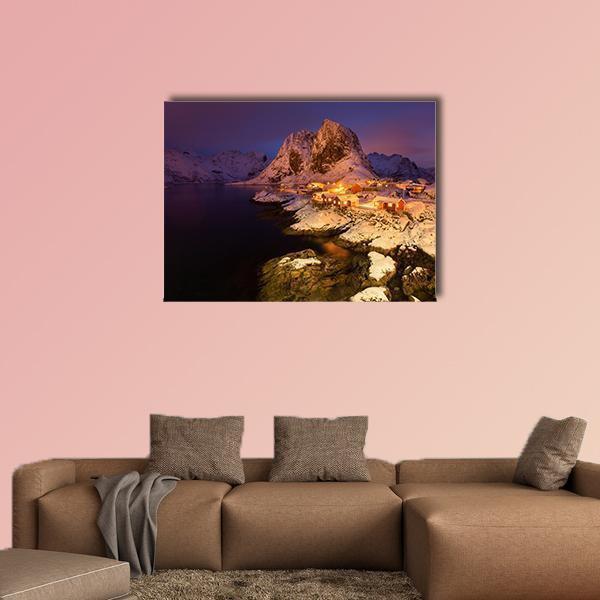 Snowy Hamnoy Village, Lofoten Canvas Wall Art in white, orange and blue, single panel hung on a wall