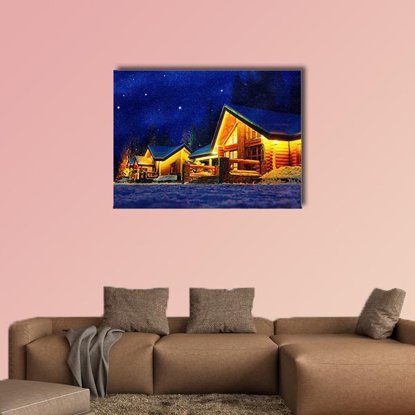 Snowy Cabins on Starry Night Canvas Wall Art in white, yellow and blue, single panel hung on a wall