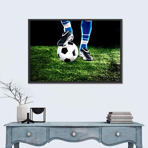 Soccer Ball and Player Canvas Wall Art in black, white and green, hung on a wall