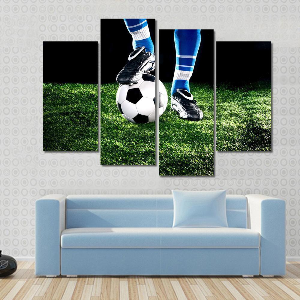 Soccer Ball and Player Canvas Wall Art in black, white and green, hung on a wall