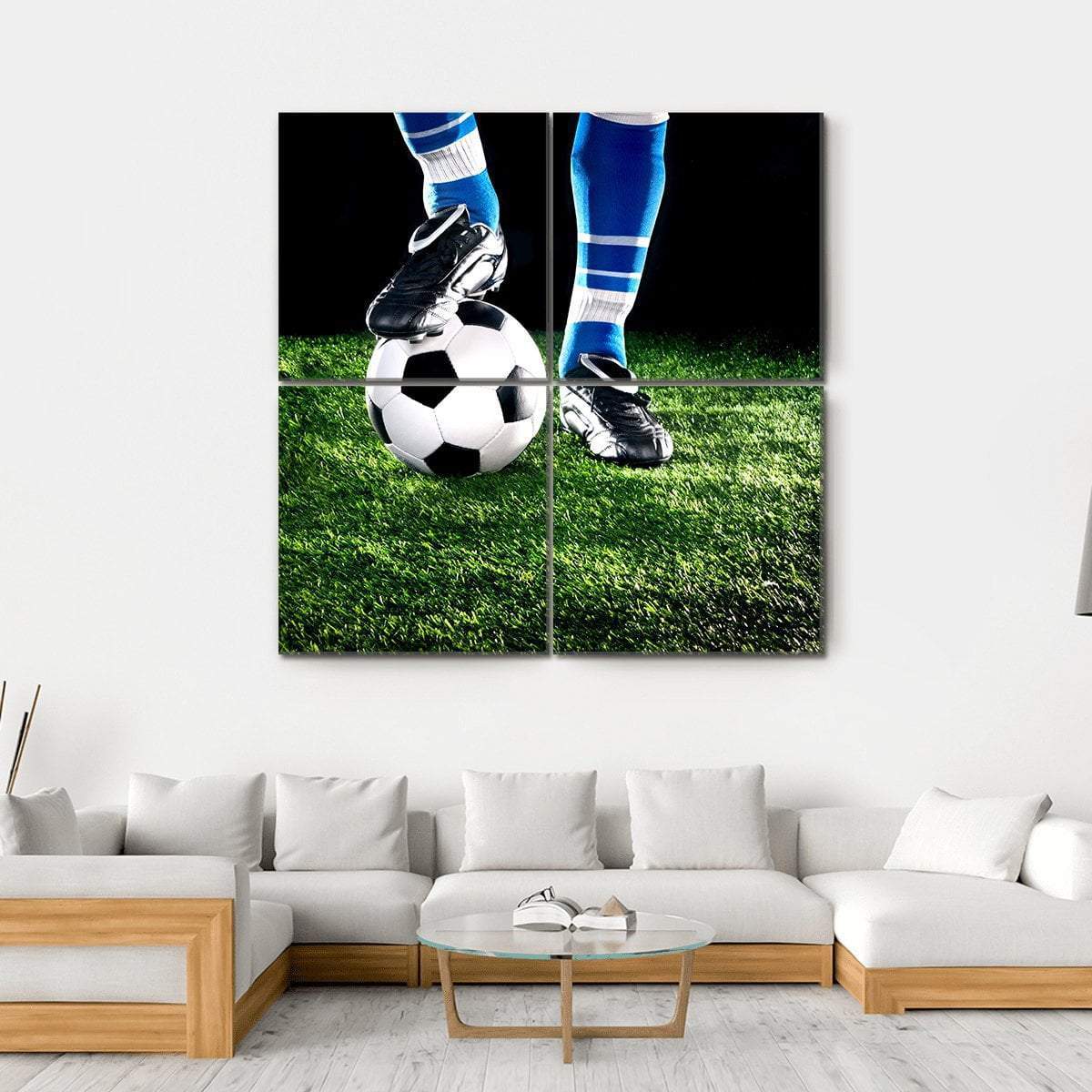 Cleat Resting on Soccer Ball Canvas Wall Art in black, green and blue, hung on a wall