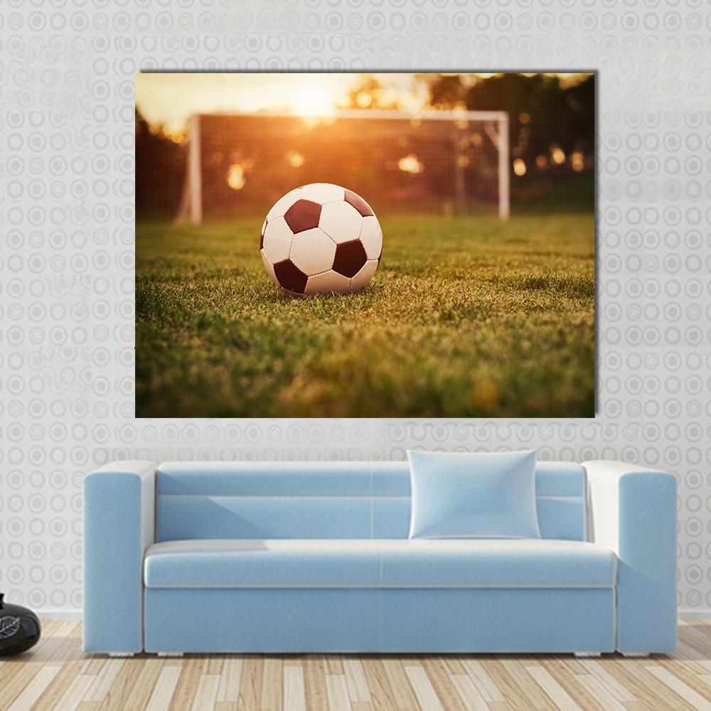 Soccer at Sunset Canvas Wall Art in orange, yellow and green, 5 panel Pop layout hung on a wall