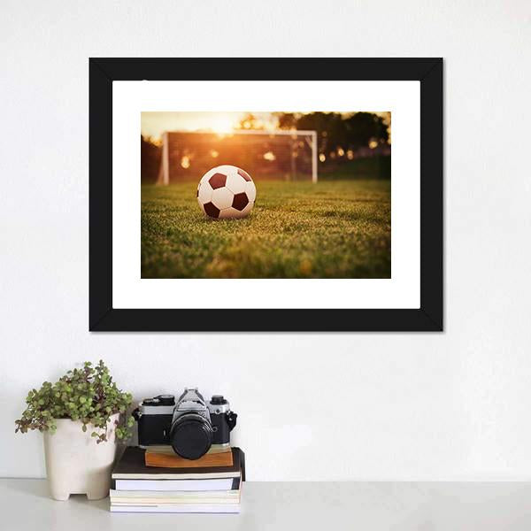 Soccer at Sunset Canvas Wall Art in orange, yellow and green, framed print, product view on a white background