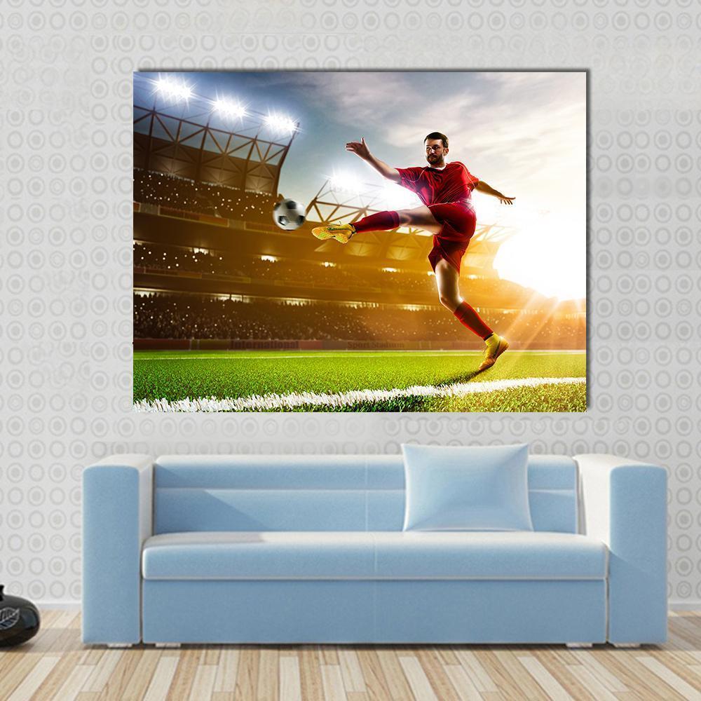 Soccer Player in Stadium Canvas Wall Art in red, yellow and green, single panel hung on a wall
