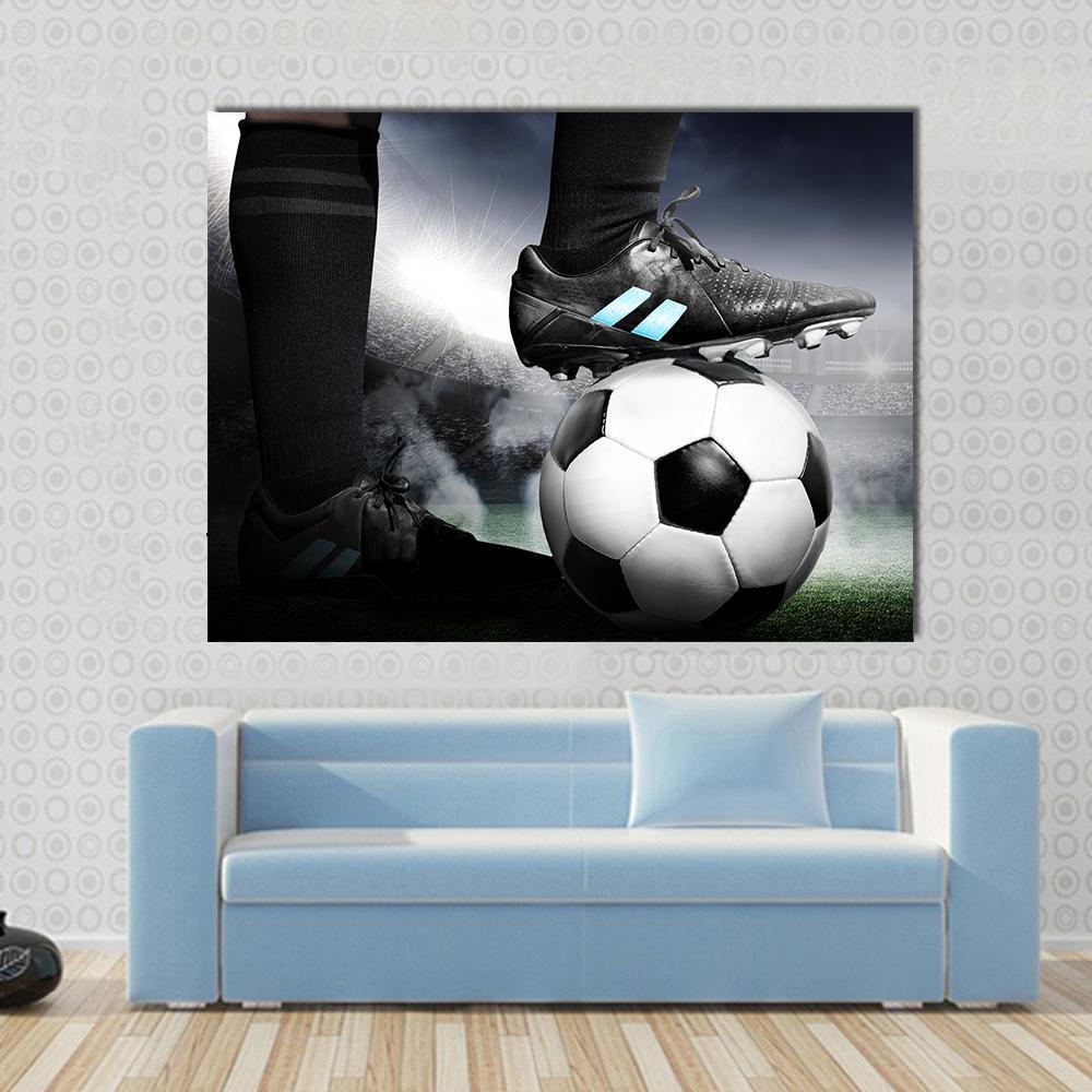 Soccer Player with Soccer Ball Canvas Wall Art in black, white and gray, 4 panel Pop layout hung on a wall
