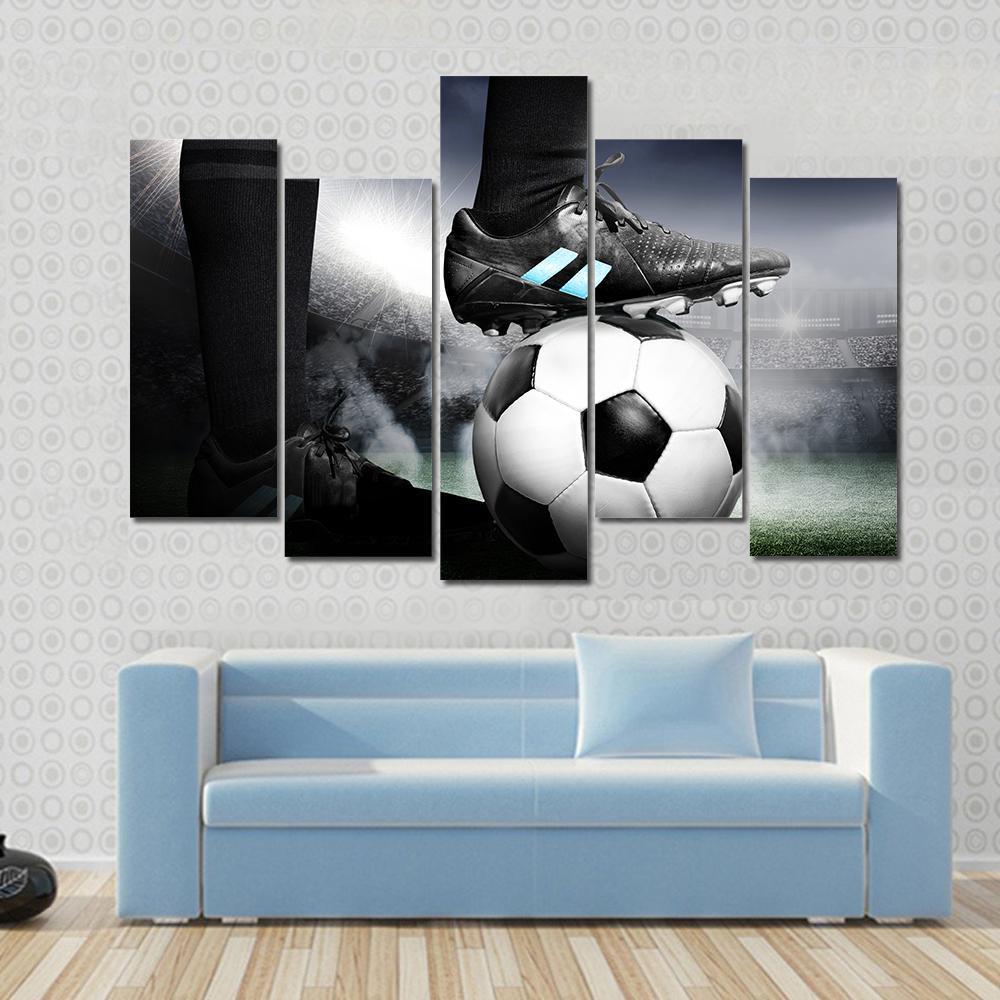 Soccer Player with Soccer Ball Canvas Wall Art in black, white and gray, 4 panel Pop layout hung on a wall