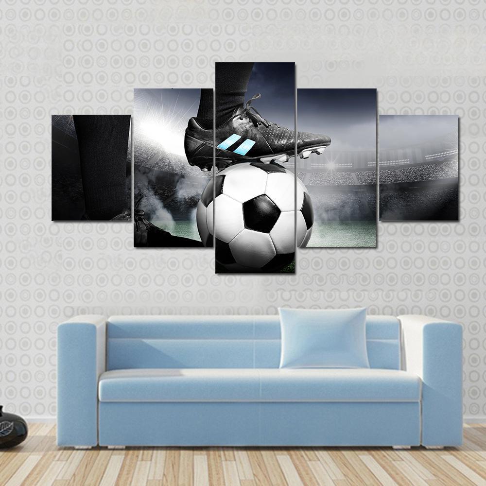 Soccer Player with Soccer Ball Canvas Wall Art in black, white and gray, 5 panel Star layout hung on a wall