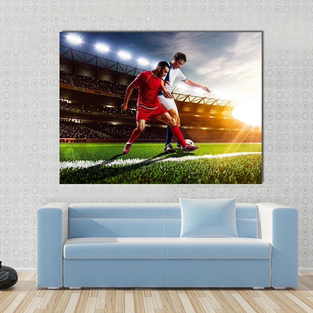 Soccer Players in Action Canvas Wall Art in red, green and blue, single panel hung on a wall