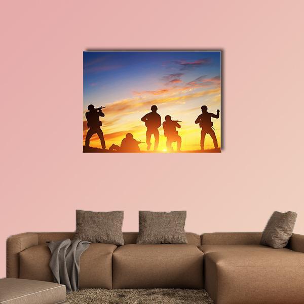 Soldiers with Rifles at Sunset Canvas Wall Art in black, orange and blue, single panel hung on a wall