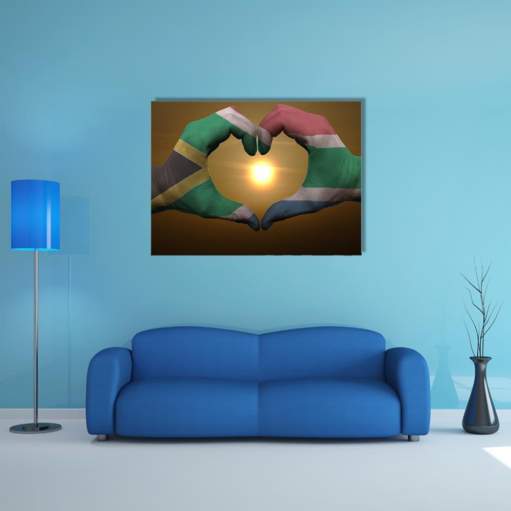 Hands Forming Heart with South Africa Flag Canvas Wall Art in brown, yellow and green, single panel hung on a wall