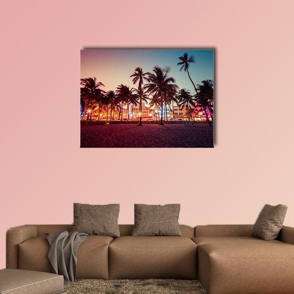 South Beach Florida Sunset with Palm Trees Canvas Wall Art in orange, purple and pink, single panel hung on a wall
