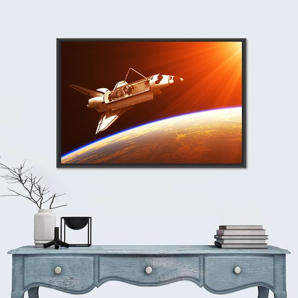 Space Shuttle Over Earth at Sunrise Canvas Wall Art in black, orange and yellow, framed canvas, product view on a white background