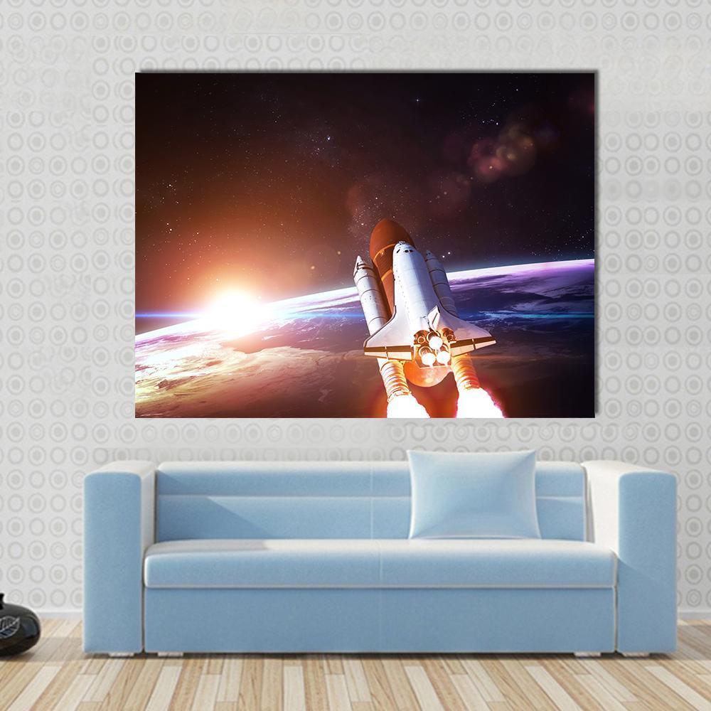 Space Shuttle Taking Off on a Mission Canvas Wall Art in black, orange and blue, single panel hung on a wall