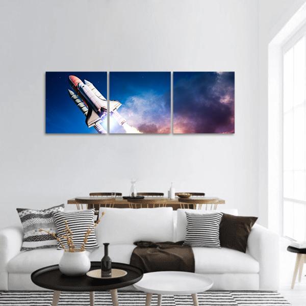 Space Shuttle Launch at Night Panoramic Canvas Wall Art in black, white and blue, hung on a wall