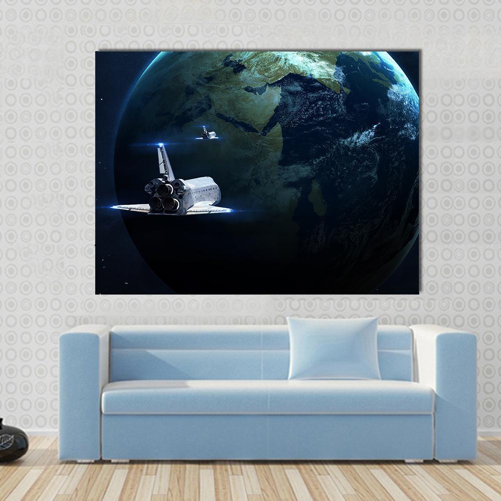 Spaceship Approaching Earth Canvas Wall Art in black, white and blue, single panel hung on a wall