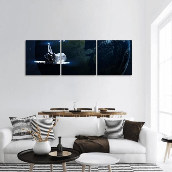 Spaceship Approaching Earth Panoramic Canvas Wall Art in black and blue, hung on a wall