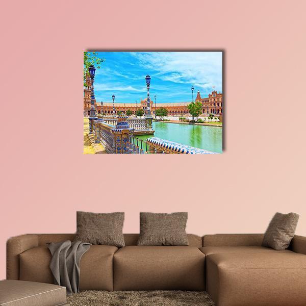 Plaza De España, Seville Canvas Wall Art in brown, orange and blue, single panel hung on a wall