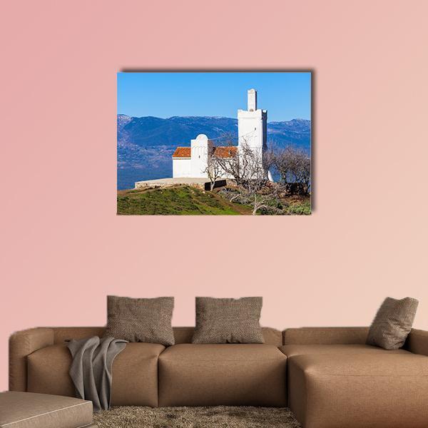 Spanish Mosque in Chefchaouen Morocco Canvas Wall Art in white, brown and blue, single panel hung on a wall