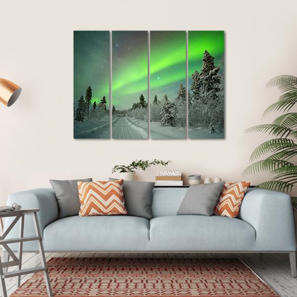 Aurora Borealis Over Snowy Road Canvas Wall Art in white, gray and green, single panel hung on a wall