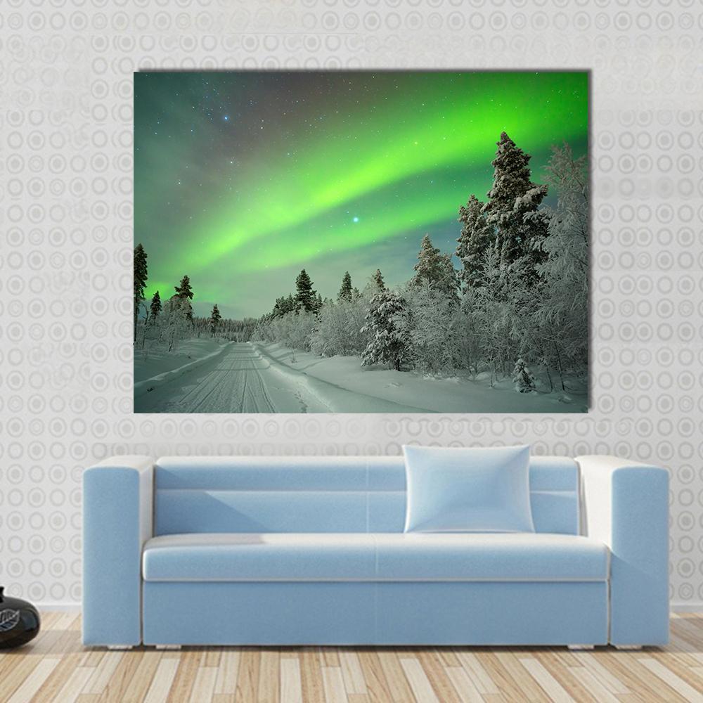 Aurora Borealis Winter Landscape Canvas Wall Art in white and green, 4 panel Pop layout hung on a wall