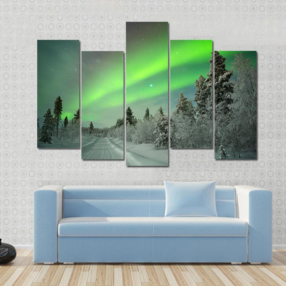 Aurora Borealis Winter Landscape Canvas Wall Art in white and green, 4 panel Pop layout hung on a wall