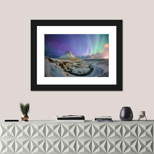 Northern Lights Over Kirkjufell Canvas Wall Art in white, green and purple, 3 panel horizontal set hung on a wall