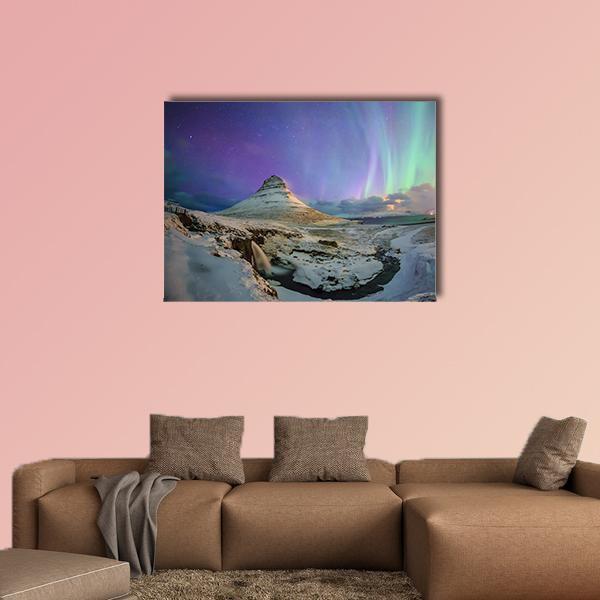 Northern Lights Over Kirkjufell Canvas Wall Art in white, green and purple, 3 panel horizontal set hung on a wall