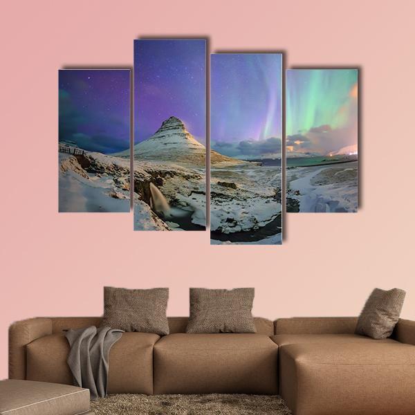 Northern Lights Over Kirkjufell Canvas Wall Art in white, green and purple, 3 panel horizontal set hung on a wall