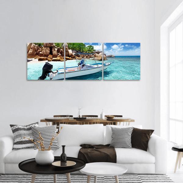 Speed Boat on Coco Island Panoramic Canvas Wall Art in white, brown and blue, hung on a wall