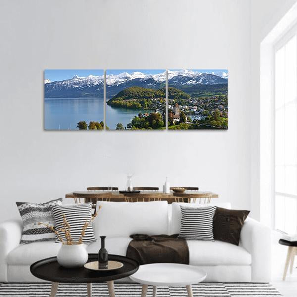 Spiez Castle in Switzerland Panoramic Canvas Wall Art in white, green and blue, hung on a wall
