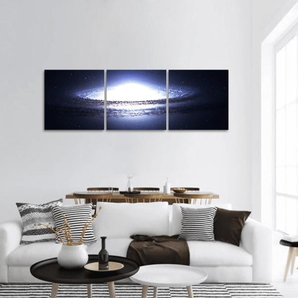 Spiral Galaxy in Deep Space Panoramic Canvas Wall Art in black, white and blue, hung on a wall