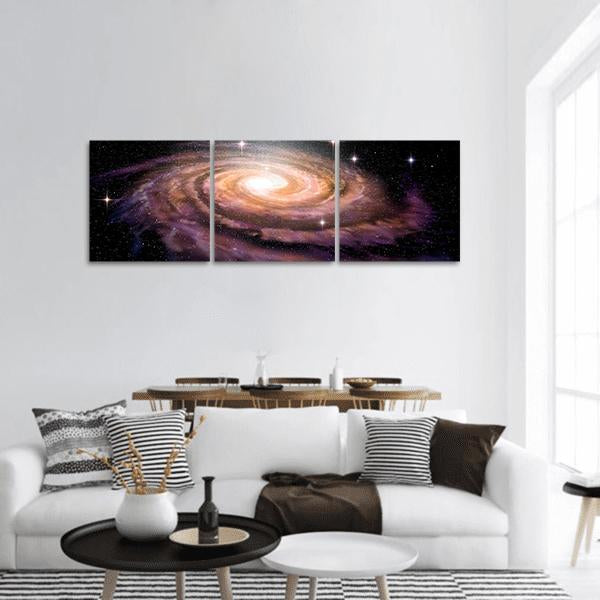 Spiral Galaxy in Deep Space Panoramic Canvas Wall Art in black, yellow and purple, hung on a wall