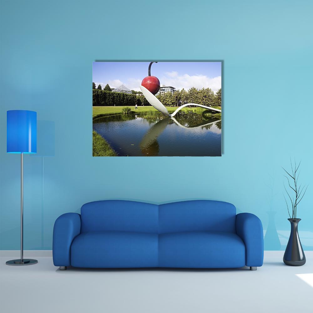 Spoonbridge and Cherry Sculpture Canvas Wall Art in silver, green and blue, single panel hung on a wall
