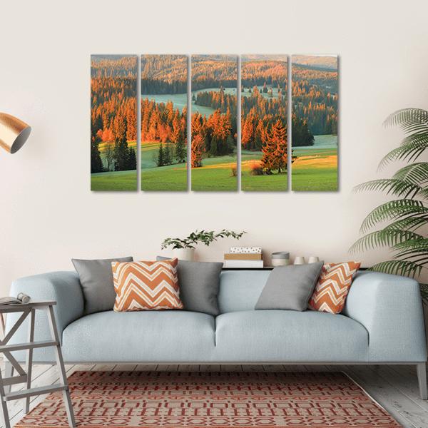 Autumn Valley Meadow and Mountains Canvas Wall Art in brown, orange and green, hung on a wall