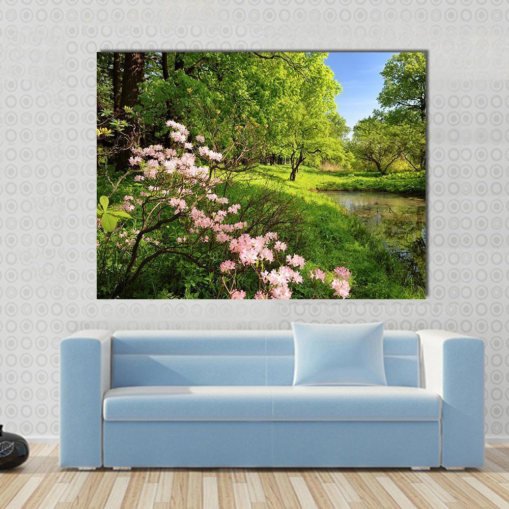 Spring Landscape with Pond and Rhododendron Canvas Wall Art in green, blue and pink, single panel hung on a wall