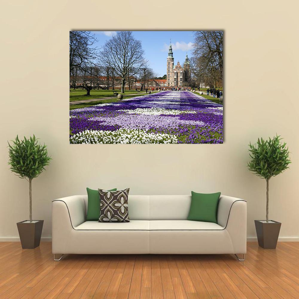 Rosenborg Castle Crocus Field, Copenhagen Canvas Wall Art in green, blue and purple, single panel hung on a wall