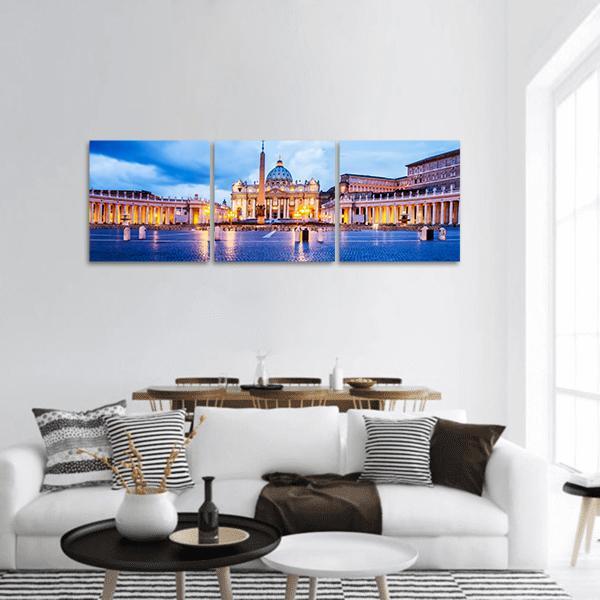 St. Peter's Basilica at Twilight, Vatican Rome Panoramic Canvas Wall Art in gold, yellow and blue, hung on a wall