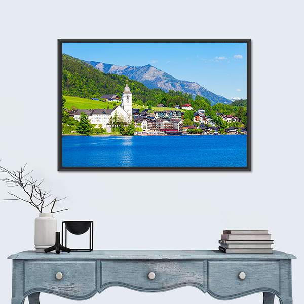 St Wolfgang Church by the Lake Canvas Wall Art in green and blue, framed canvas, product view on a white background