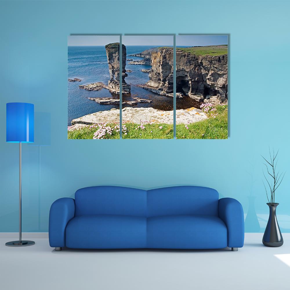 Yesnaby Sea Stacks, Orkney Canvas Wall Art in gray, brown and blue, 3 panel horizontal set hung on a wall