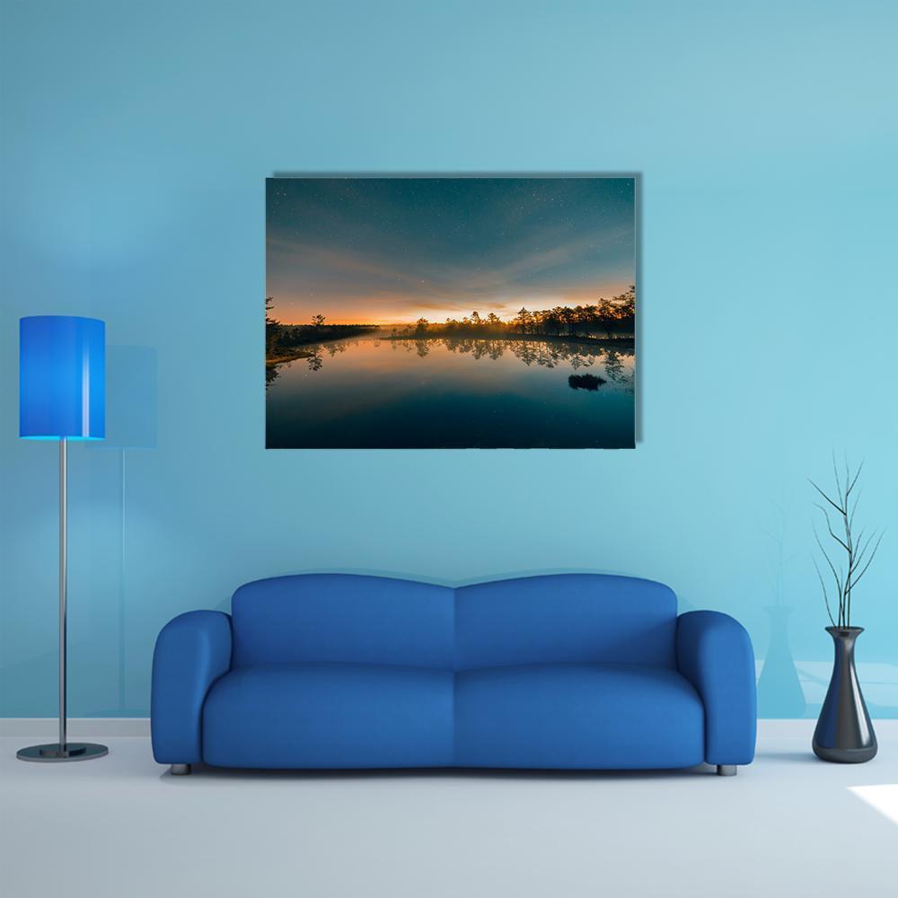 Starry Night at a Swamp Canvas Wall Art in black, orange and blue, single panel hung on a wall