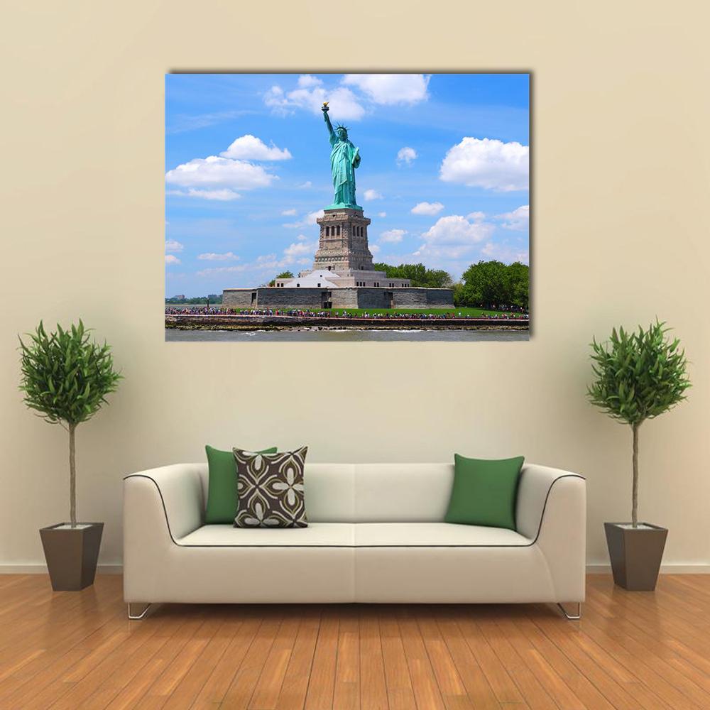 Statue of Liberty in New York Harbor Canvas Wall Art in white, green and blue, single panel hung on a wall