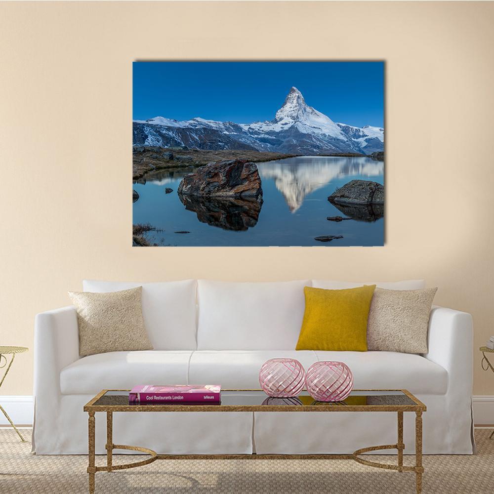 Matterhorn Reflection on Lake Canvas Wall Art in white, gray and blue, single panel hung on a wall