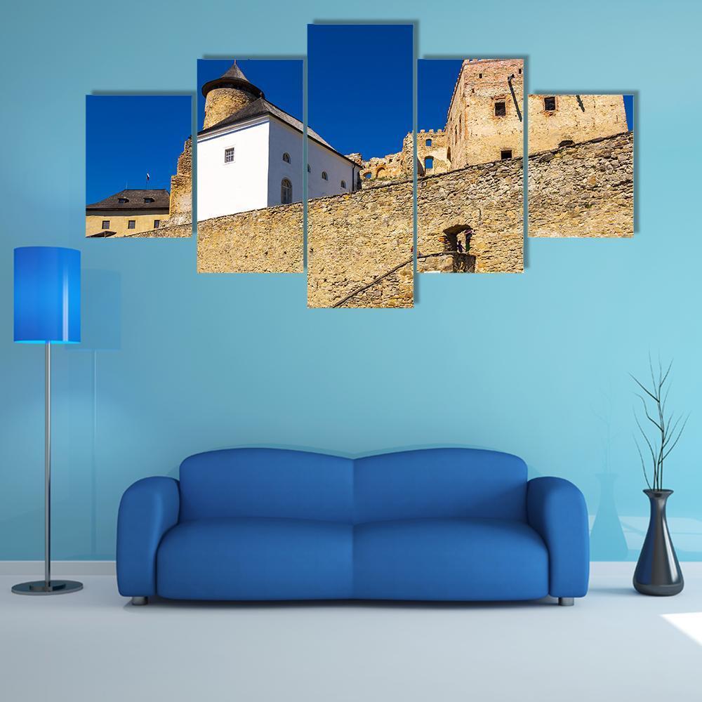 Stone Walls of Stara Lubovna Castle Canvas Wall Art in beige, brown and blue, 5 panel Star layout hung on a wall