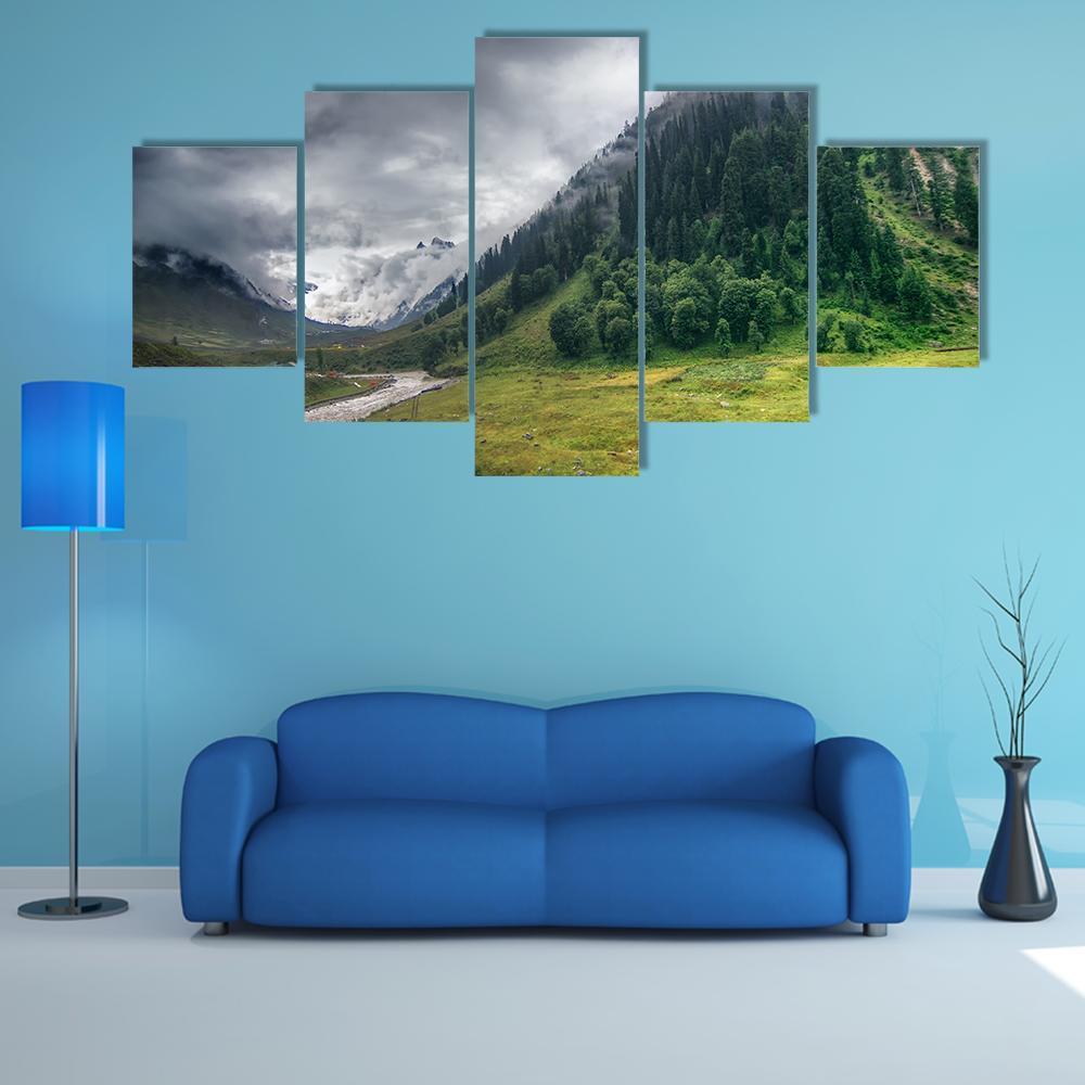 Storm Clouds Over Snow-capped Mountains Canvas Wall Art in white, gray and green, 5 panel Star layout hung on a wall