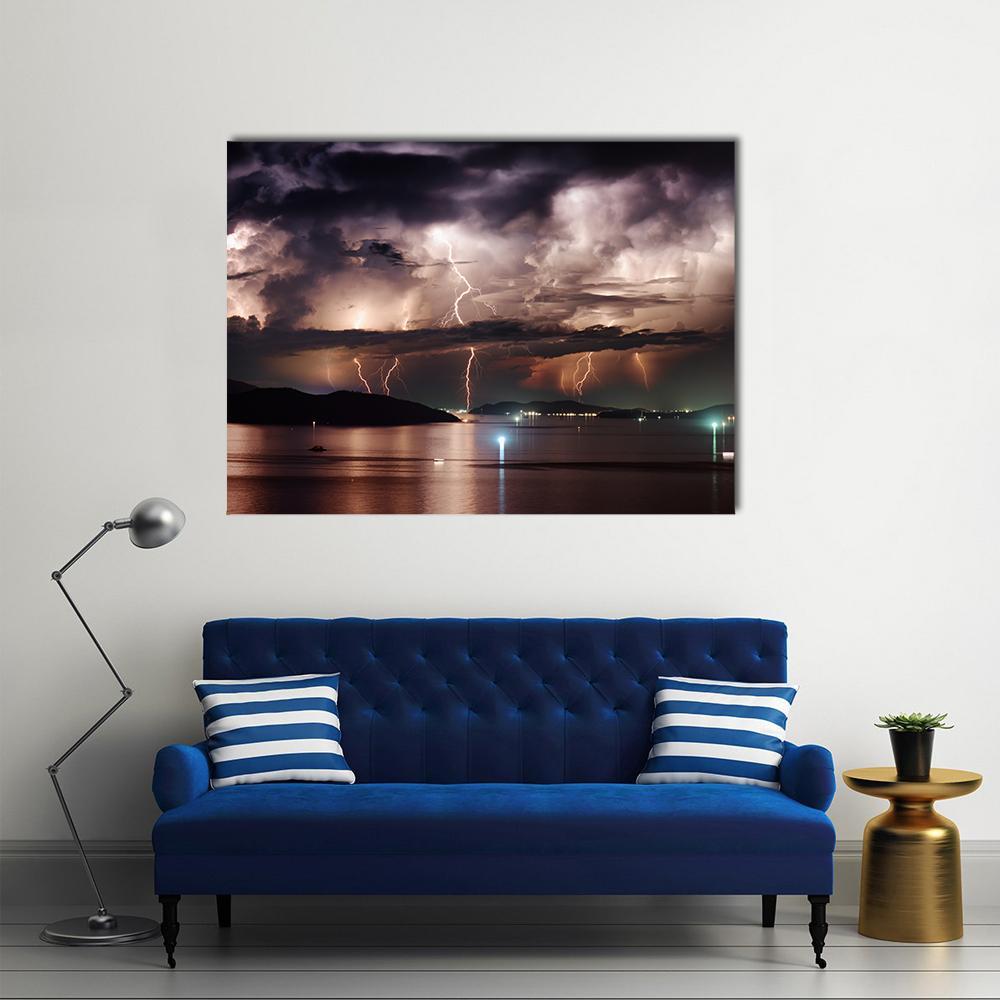 Dramatic Lightning Strikes Over Ocean Canvas Wall Art in black, brown and purple, single panel hung on a wall